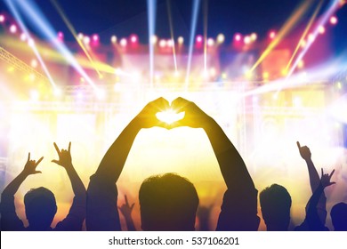 Heart And Live Shaped Hands At Crowd Of People At During A Live Concert