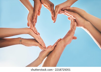 Heart, love and group hands for support, care and community with outdoor summer sunshine, blue sky and mock up. Group of people with care sign for solidarity, health and wellness background mockup - Shutterstock ID 2218725051
