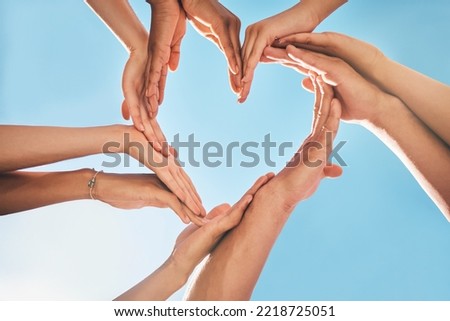 Heart, love and group hands for support, care and community with outdoor summer sunshine, blue sky and mock up. Group of people with care sign for solidarity, health and wellness background mockup