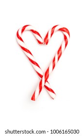 Heart made of candy canes isolated on white background