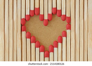 Heart made of matches on recycled paper background - Love concept