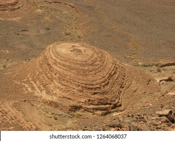 Heart Made Of Stones On Top Of Erupted Moutain, Top View, In Barren Stone Desert Of Morocco.