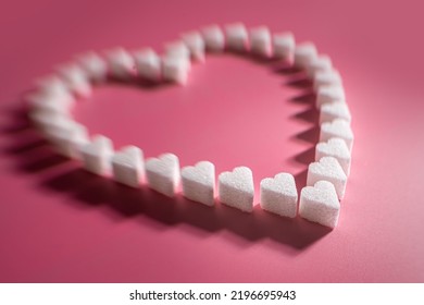 Heart Made Of Sugar Cube Hearts On Pink Background, Selective Focus