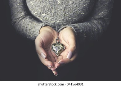 Heart Necklace In Woman Hands