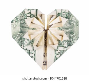 Heart Of Origami From The Dollar. Origami Of Money. Dollar Folded Into Heart Isolated On White Background. Valentine's Heart.