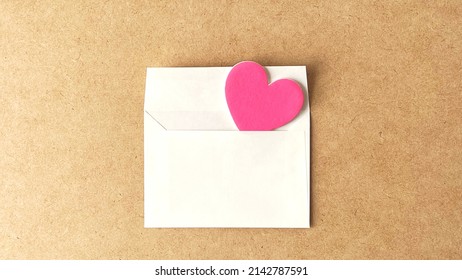 Heart out of the envelope in cork background
