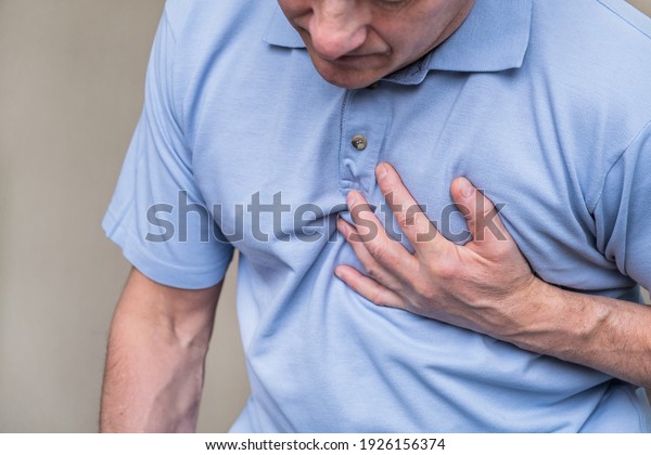 Heart Pain Person Grabbing Heart Area Stock Photo (Edit Now) 1926156374