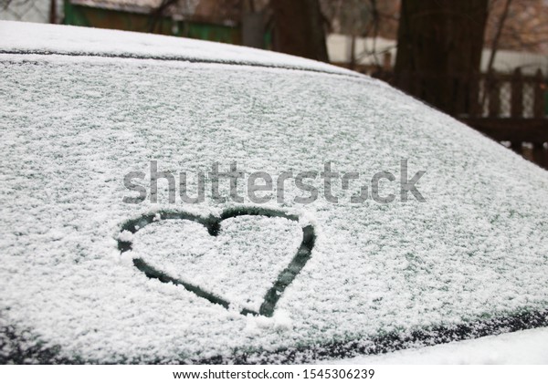 heart  painted on car\
glass