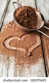 Heart Painted On Cocoa Powder And Sieve