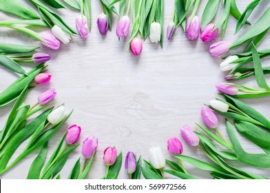 Heart From Pink Tulips Flowers  On Rustic Table For March 8, International Womens Day, Birthday , Valentines Day Or Mothers Day - Closeup