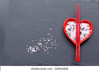 Heart plate with long grain and wild rice with chopstick on stone plate 