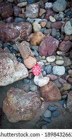 Heart Printed Deflated Balloon In A Stones Ground 