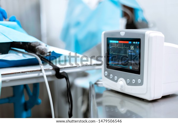 Heart rate monitor\
in hospital theater. Medical vital signs monitor instrument in a\
hospital on anesthesia surgery monitor.  ECG Patient Monitor.\
medical electronics.