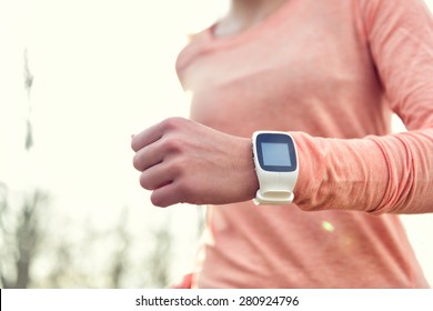 Heart Rate Monitor Smart Watch For Sport. Athlete Wearing Heart Rate Monitor. Runner Using Sports Smartwatch On Running Workout Outside. Female Athlete Tracking Activities Using Wearable Technology.