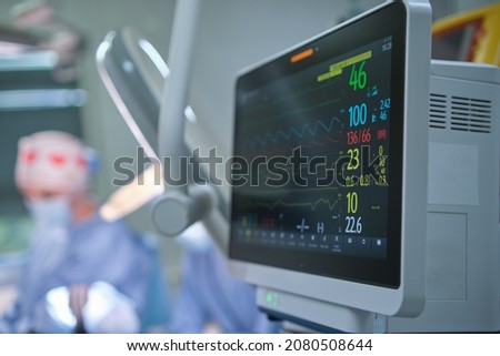 Heart rate and patient condition control monitor in hospital theater room during surgery operation.