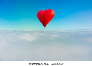 Heart Red Color Hot Air Balloon In Blue Sky With Clouds Closeup