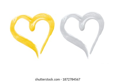 Heart set - cosmetic, lipstick or foundation samples isolated on white. Trendy colors of the year 2021 - Yellow and Gray