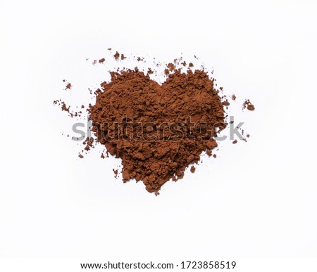 Heart shape cocoa powder on white background