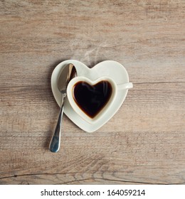 Heart Shape Coffee Cup On Wooden Table