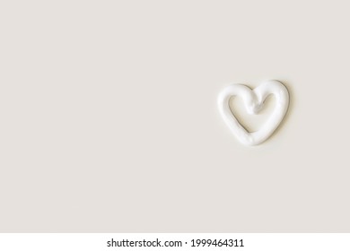 Heart Shape Cream. Beauty Lotion. Mayonnaise Smear On White Plate. Top View With Copyspace. White Product Smear. Valentine Concept