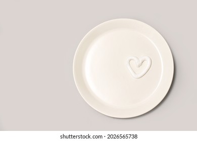 Heart Shape Cream. Beauty Lotion. Mayonnaise Smear On White Plate. Top View With Copyspace. White Product Smear. Valentine Concept