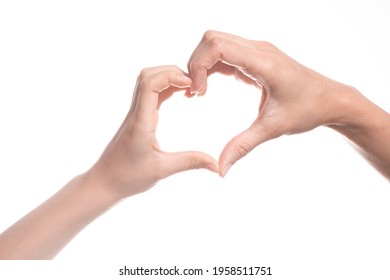 Heart Shape Created From Kid And Mother Hands On White Background. Love, Happiness, Parenthood, Family, Gesture Concept. Close Up