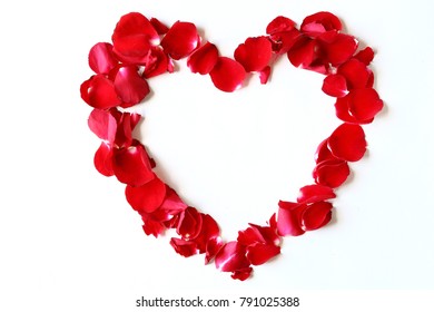 Heart shape decoration by fresh red rose petals, isolated on white. - Powered by Shutterstock