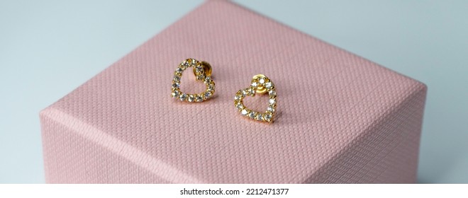 Heart shape earring in pink gift box for babies - Shutterstock ID 2212471377