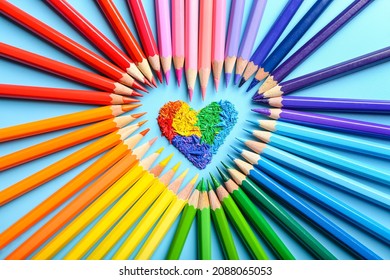 Heart shape made of colorful pencils on color background - Powered by Shutterstock