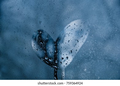 Heart shape on droplet window of cold misty morning - Powered by Shutterstock