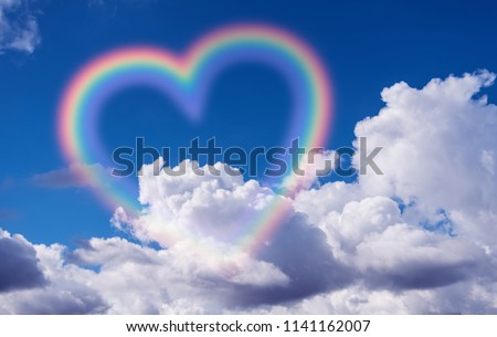 Heart shape rainbow in the sky.