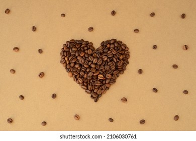 Heart shape of roasted coffee beans, pattern of coffee beans on kraft paper background, coffee lovers valentine - Powered by Shutterstock