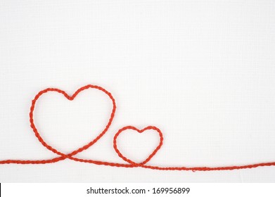 Heart shape rope on white fabric