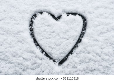 Heart Shape In Snow On Car Window