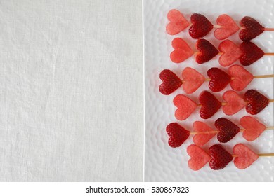 Heart Shape Strawberry And Watermelon Fruit Skewers On White Plate