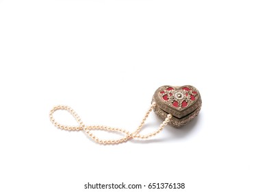 Heart shaped antique jewelry box with pearls