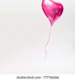 Heart Shaped Balloon Floating Away. Minimal Love Concept.