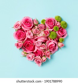 Heart shaped bouquet of beautiful fresh pink rose flowers on pastel blue background. Minimal Valentines Day, Easter, wedding or Mother's day concept. Creative spring or summer floral layout. Flat lay. - Powered by Shutterstock