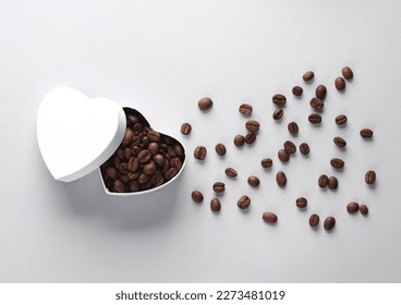 Heart shaped box with coffee beans on gray background - Powered by Shutterstock