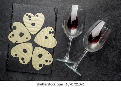 
Heart shaped cheese and glasses of wine on stone background - Powered by Shutterstock