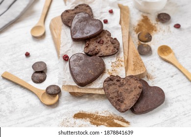Heart shaped chocolate bars with chocolate chips, nuts, raspberries and cinnamon, Valentine's Day home made low carb treats, sugarless keto paleo dessert