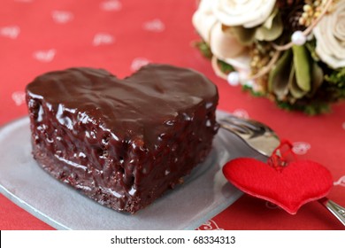 Heart Shaped Chocolate Cake With Heart Decoration And Bouquet