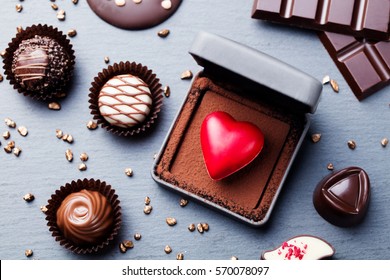 Heart Shaped Chocolate Candy In A Gift Box On Slate Background. Copy Space Top View