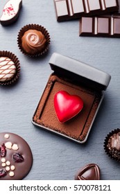 Heart Shaped Chocolate Candy In A Gift Box On Slate Background. Top View.