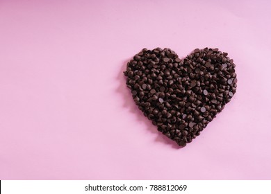 heart shaped chocolate chip for valentines concept on pink background - Powered by Shutterstock