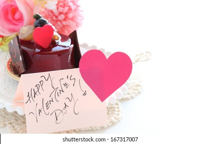 heart  shaped chocolate on raspberry cake for valentine's day dessert image