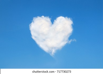 heart shaped cloud in the blue sky - Powered by Shutterstock