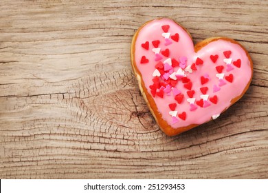 Heart Shaped Donut On Wooden Background