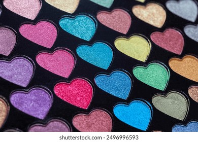 Heart Shaped Eyeshadow Set. Eyeshadow palette with colorful heart shaped refills close-up. Macro eyeshadow.