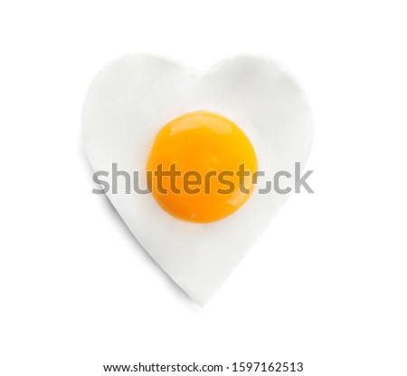 Heart shaped fried egg isolated on white, top view